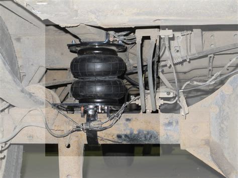 Регулировка высоты автомобиля без использования пневматической подвески